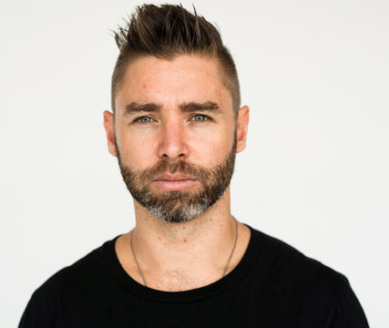 Portrait of a white adult man with beard and short styled hair