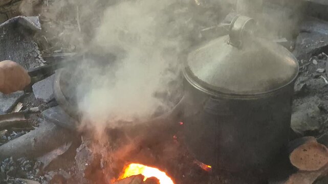 Traditional Coffee Bean Roasting Process on Wood Fire Stove with Thick Smoke