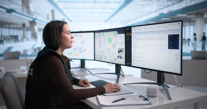 Police Officer Reviews Digital Case Files