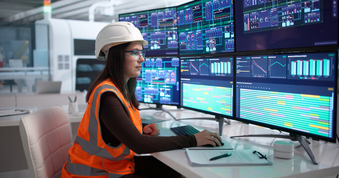 Young Woman Engineer Uses Computer
