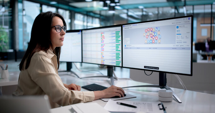 Woman Monitors Real-time Transaction Graphs For Fraud Detection
