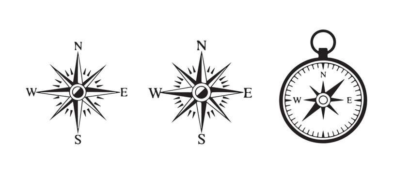 Vintage nautical compass collection with intricate wind rose designs for cartography and exploration.