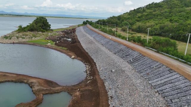 The rocks of various sizes lining the embankment to protect the dam and road would be damaged during the rainy season.