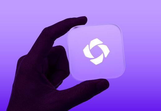 Hand Holding App Icon Mockup PSD