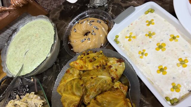 Sausage platter bowl of Olivier salad Persian cuisine Iran Tehran family gathering festive scene sliced smoky table dining garnish pickle creamy sauce homemade appetizer meal party traditional bandari