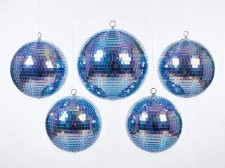 Obraz premium Five blue disco balls hanging isolated on white background
