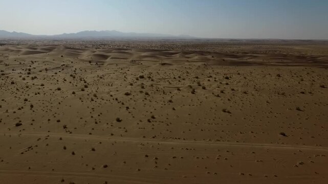 Beautiful drone view of open desert plain with natural lines.