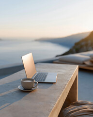 Fototapeta premium Sunset bathes a minimalist table beside a sea view. Open laptop sits ready for work or thought. Cup of coffee rests nearby, warm and quiet. Serene atmosphere suggests peace or focus