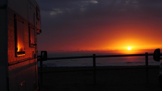 Camper rv on beach at sunrise, Spain

