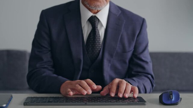 A male business professional operating a PC keyboard. Typing, engineer, programmer, system, development.