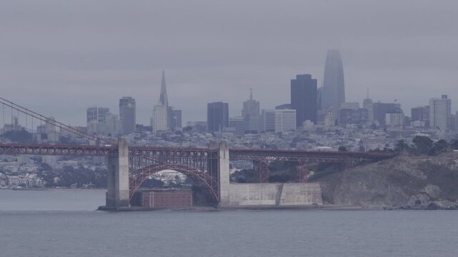 Foggy Golden Gate Bridge South Tower and Fort Point Viewed from Water - Wide Shot
