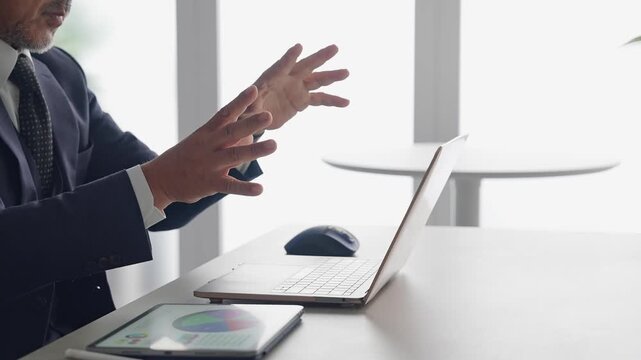 A male business professional interacting with a screen in mid-air. VR, virtual, hologram, operation, 3D image, office.