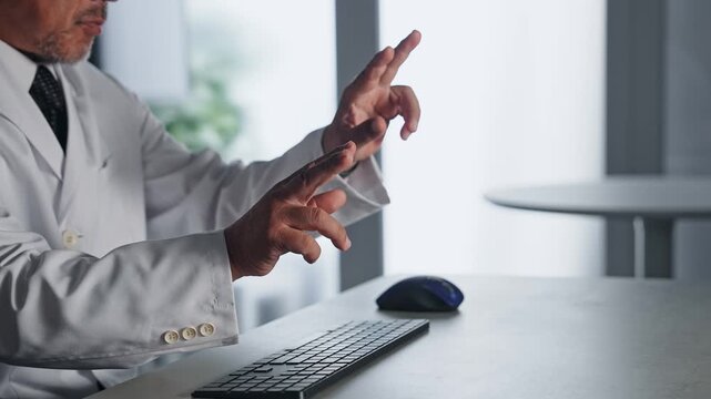 A man in a white coat interacting with a screen in mid-air. VR, virtual, science, research, development, doctor, hologram, sensor.