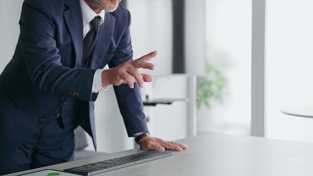 A male business professional interacting with a screen in mid-air. VR, virtual, DX, business, IT, touch, operation, screen.