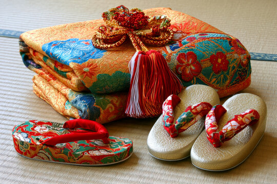 Colorful Japanese Fabric Wrapped Gift with Traditional Sandals on Tatami