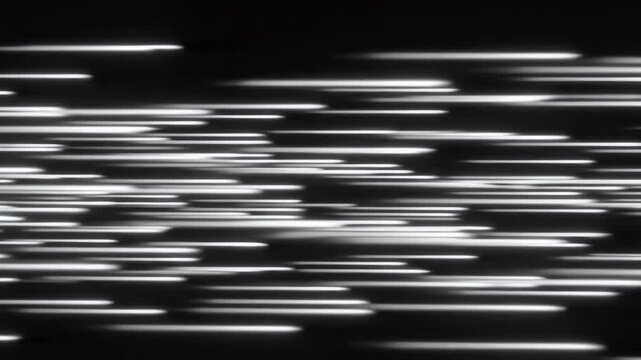 abstract horizontal white speed lines rushing across a pitch black background for fast-paced motion concepts