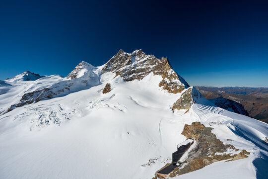 Jungfrau mountain peak and glacier under clear sky. Jungfraujoch, Canton of Bern, Switzerland.