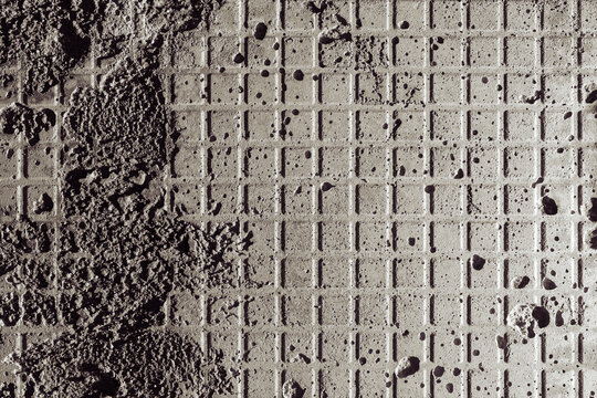 Industrial Concrete Wall or Floor Texture Background with a Square Grid Pattern and Imperfect Rough Marks
