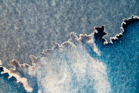 Paper texture with Ink stain look like Dark Cloudy sky with silver lining 