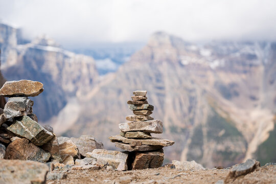 Balancing stones and mountain peak landscape in the background. Stack of stones, Pile of rocks, stones tower. Spirit of Zen.