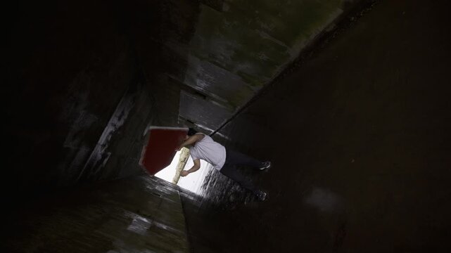 Professional Athlete Doing Epic Sign Tricks In Dark Tunnel In San Francisco - Cinematic tilt shot