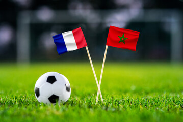 Fototapeta premium France vs Morocco, Quarterfinals, national flags before international football match, football on green grass with stadium in the background, Foxborough, United States, July 9, 2026