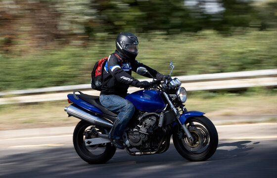 Milton Keynes,Bucks,UK - July 4th 2026: Man riding a 2002 Honda Cb 600 F-2 motorcycle driving on a British road