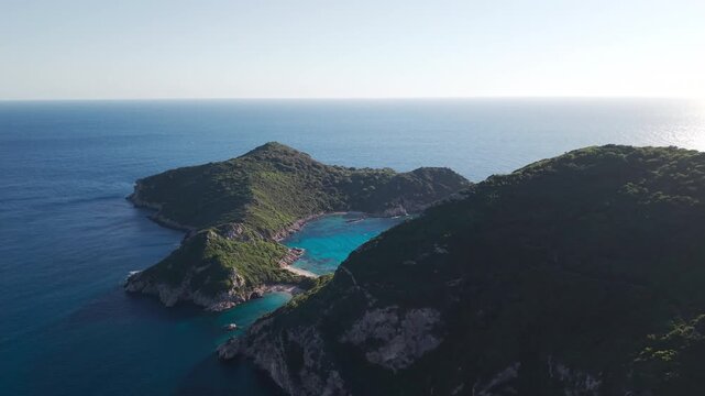 Aerial drone shot of Porto Timoni double beach and green hills in Corfu
