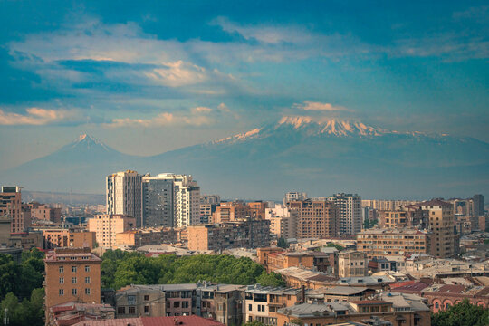 Yerevan city panorama with double peaks of mount Ararat and Sis with copy space