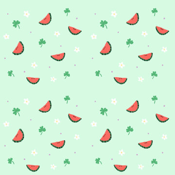cute watermelon seamless pattern with clover flowers on pastel green background
