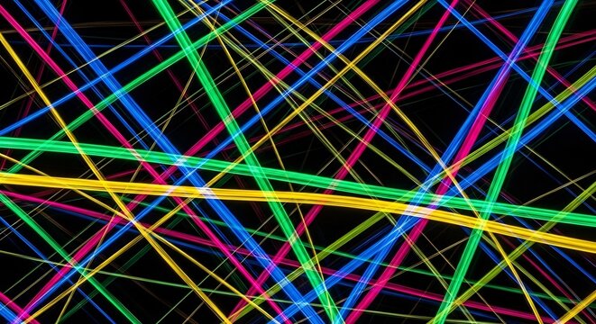 Abstract neon light trails creating a vibrant and colorful background design.