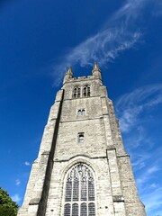 Fototapeta premium Tenterden, June 2026: A visit to the beautiful medieval village of Tenterden, overlooking the River Rother in East Sussex, England - View of the church