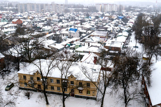 Voronezh, Russia, January 3, 2026: Winter residential area of ​​Voronezh with private sector and multi-story buildings, view from above