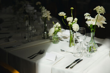 Elegant table setting with candlelight, wedding reception, indoors © Framed by Evelina