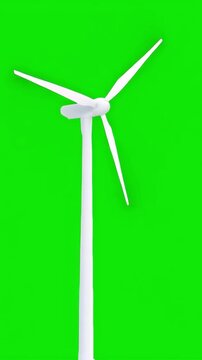 Modern white wind turbine spinning on an empty green screen background, vertical video featuring clean renewable energy for chroma key compositing and sustainability projects
