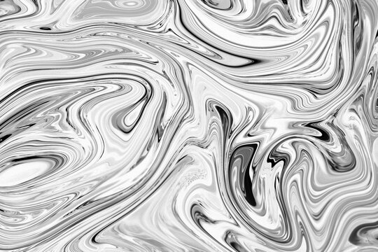 Swirling and shiny liquid or fluid material that looks like silver, chrome or metal. Abstract high resolution luxurious and glamorous background.