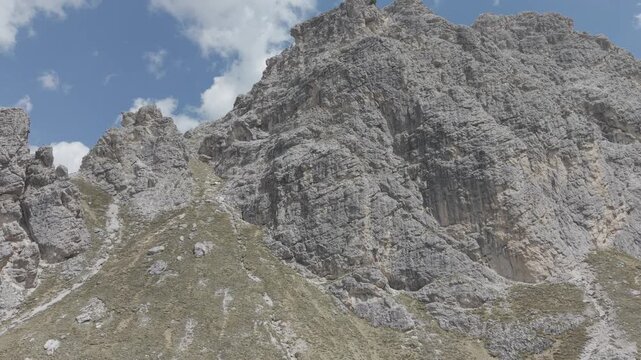 Dramatic Snow-Capped Jagged Mountain Peaks Under Blue Sky
