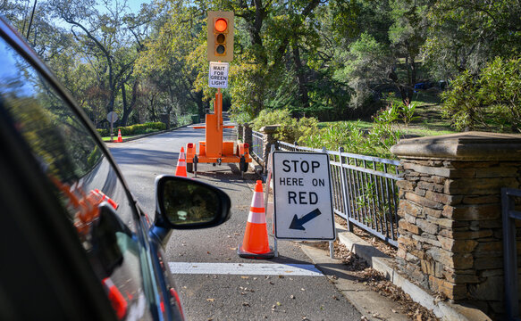 Roadwork and temporary traffic light at Villa Montalvo Trail. Saratoga, California.