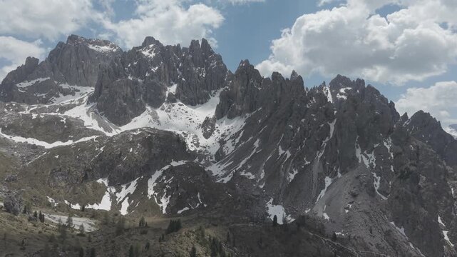 Dramatic Snow-Capped Jagged Mountain Peaks Under Blue Sky