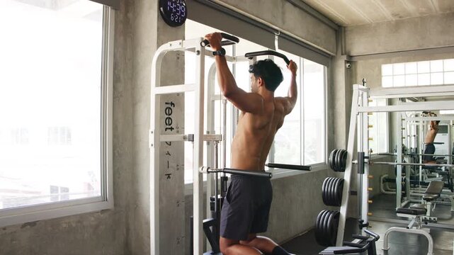 Athlete Performing Pull Up in Gym