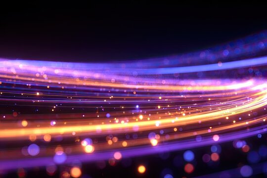 Vibrant swirling light streaks and bokeh particles on dark background
