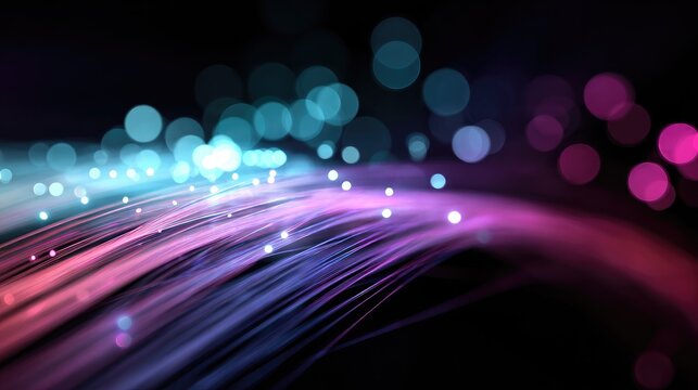 Abstract glowing strands of light in purple and blue hues against dark