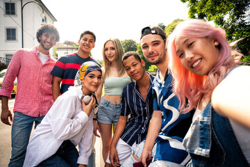 Fototapeta premium Group of multiethnic teenagers spending time outdoor and having fun