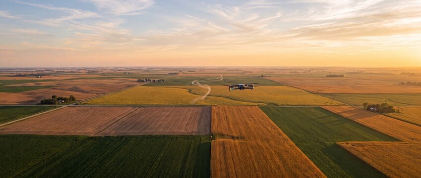 Drone surveys regenerative farmland showing technology and harvest during golden hour.