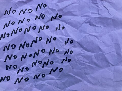 word No written on wrinkled paper, handwritten text, The answer yes is written in letters of words no, on crumpled paper, showing the hidden meaning and ambiguity of the agreement