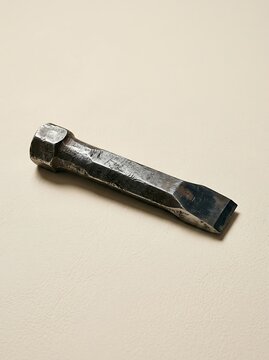 Vintage Metal Cold Chisel Hand Tool on Neutral Background