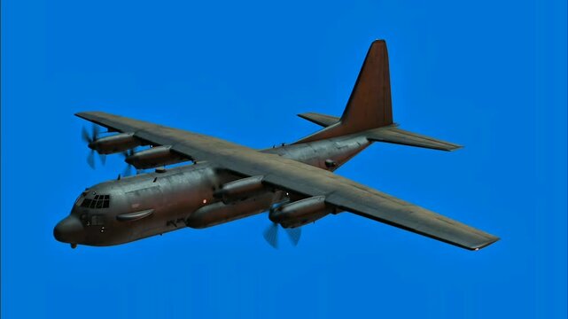 A robust, multi-engine aircraft soars through a brilliant blue sky. Its dark fuselage and spinning propellers suggest powerful flight. This heavy-duty air transporter dominates the vast expanse.