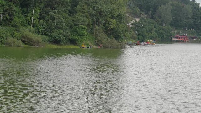 Cinematic Panning Shot Of Bhimtal Lake And Forest Shoreline Uttarakhand