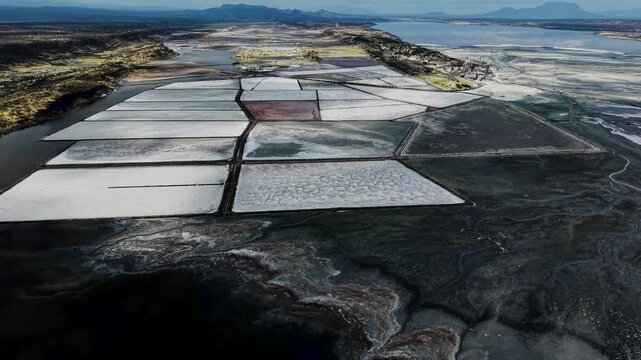 Lake Magadi kenya Sodaash Alkaline water salt lake Trona mineral deposits rift valley kenya . kenyan lake with Trona.