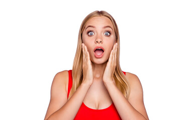 Portrait of attractive shocked blonde gorgeous girl wearing red swim suit holding palms near cheeks, surprised expression. Isolated over violet pastel background © deagreez